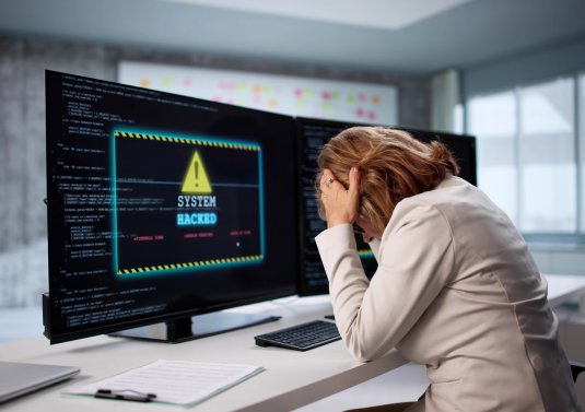 Picture of a frustrated employee dealing with a cyber attack